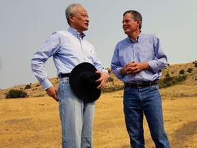 In this Sept. 8, 2017 photo, Chinese ambassador to the United States Cui Tiankai, left, speaks with Republican Montana Sen. Steve Daines about ways to expand the Chinese market for Montana beef. The two met with other Chinese and Montana agriculture officials during a tour of a ranch in the Bozeman area. China's largest online retailer has signed a deal with the Montana Stockgrowers Association to buy $200 million worth of Montana beef over the next three years and to build a $100 million slaughterhouse in the state. (Tom Lutey Gazette Staff/The Billings Gazette via AP)