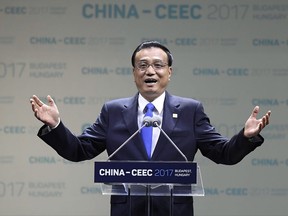 Chinese Prime Minister Li Keqiang addresses the opening session of the summit of China and sixteen Central and Eastern European Countries (CEEC) in Budapest, Hungary, Monday, Nov. 27 2017. (Tamas Kovacs/MTI via AP)