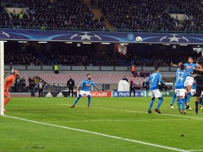Manchester City's John Stones, top right, scores his side's second goal during the Champions League Group F soccer match between Napoli and Manchester City, at the San Paolo stadium in Naples, Italy, Wednesday, Nov. 1, 2017. (Ciro Fusco/ANSA via AP)