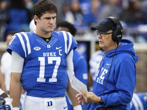 Duke Head Coach David Cutcliffe speaks with quarterback Daniel Jones prior to an an NCAA college football game against Georgia Tech in Durham, N.C., Saturday, Nov. 18, 2017. (AP Photo/Ben McKeown)