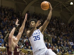 Duke's Marvin Bagley III (35) attempts a shot over Elon's Tyler Seibring, left, during the second half of an NCAA college basketball game in Durham, N.C., Friday, Nov. 10, 2017. Duke defeated Elon 97-68. (AP Photo/Ben McKeown)