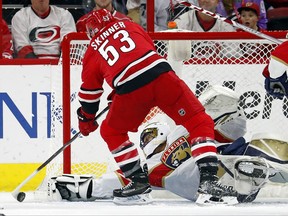 Carolina Hurricanes' Jeff Skinner (53) tries to stuff the puck past Florida Panthers goalie Roberto Luongo (1) during the first period of an NHL hockey game, Tuesday, Nov. 7, 2017, in Raleigh, N.C. (AP Photo/Karl B DeBlaker)