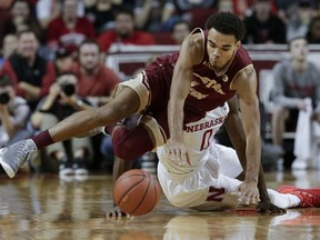 Boston College's Jerome Robinson (1) leaps for the ball in front of Nebraska's Duby Okeke (0) during the first half of an NCAA college basketball game in Lincoln, Neb., Wednesday, Nov. 29, 2017. (AP Photo/Nati Harnik)