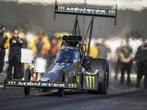In this photo provided by the NHRA, Brittany Force drives in Top Fuel qualifying Friday, Nov. 10, 2017, at the Auto Club NHRA Finals drag races at Auto Club Raceway in Pomona, Calif. Force took the top spot for the day, with qualifying continuing Saturday. (Jerry Foss/NHRA via AP)
