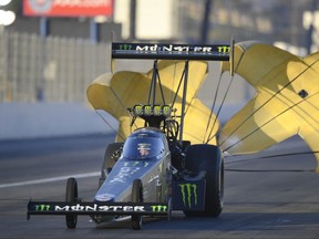 In this photo provided by the NHRA, Brittany Force slows after a run in Top Fuel qualifying at the Auto Club NHRA Finals drag races at Auto Club Raceway, Saturday, Nov. 11, 2017, in Pomona, Calif. Force's qualifying run Friday held up for the No. 1 spot. (Marc Gewertz/NHRA via AP)