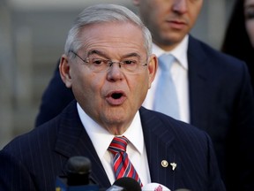 U.S. Sen. Bob Menendez speaks to reporters outside Martin Luther King Jr. Federal Courthouse after U.S. District Judge William H. Walls declared a mistrial in Menendez' federal corruption trial, Thursday, Nov. 16, 2017, in Newark, N.J. (AP Photo/Julio Cortez)