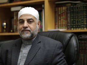 In a photo taken Wednesday, Nov. 1, 2017, Dr. Mohammad Qatanani, Imam at The Islamic Center of Passaic County in Paterson, N.J., poses for a photo.  The North Jersey Muslim community has drawn attention in the wake of an attack in Manhattan, where a Paterson resident drove a pick-up truck onto a bike path, killing several people and injuring others. (AP Photo/Julio Cortez)