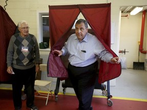 Gov. Chris Christie walks out of the voting booth after casting his ballot on Tuesday, Nov. 7, 2017 in Mendham, N.J. Democrat Phil Murphy and Republican Lt. Gov. Kim Guadagno are the two major party candidates vying to replace Christie, the two-term, term-limited incumbent. (Ed Murray/NJ Advance Media via AP)