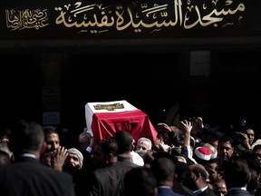 People carry the coffin of Egyptian singer and actress Shadia, during her funeral procession, at the Sayeda Nafisa Mosque in Cairo, Egypt, Wednesday, Nov. 29, 2017. Shadia died at the age of 86. (AP Photo/Nariman El-Mofty)