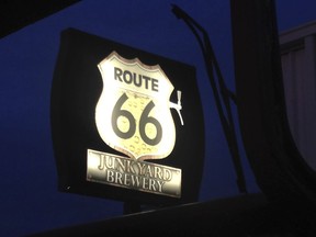 In this Dec. 10, 2015 photo provided by Henry Lackey a sign of the Route 66 Junkyard Brewery is seen in Grants, N.M. The brewery is facing a U.S. federal lawsuit from the Cyprus-based Lodestar Anstalt over claims the hangout is illegally using the iconic American highway in its name. According to the lawsuit filed in U.S. District Court in Albuquerque, Lodestar owns the U.S. trademark for Route 66 beers in the country and the highway's "shield" that go on labels for beer. (Henry Lackey via AP)