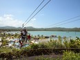 The Caribbean is open for business again. Here, a guest ziplines in Amber Cove, in the Dominican Republic.