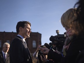 Prime Minister Justin Trudeau takes questions from the media outside the Confederation Centre of the Arts in Charlottetown, P.E.I., on Thursday, Nov 23, 2017. THE CANADIAN PRESS/Nathan Rochford