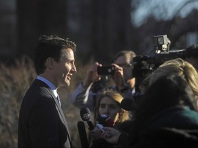 Prime Minister Justin Trudeau takes questions from the media outside the Confederation Centre of the Arts in Charlottetown, P.E.I., on Thursday, Nov 23, 2017. THE CANADIAN PRESS/Nathan Rochford