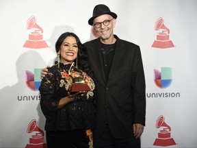 Lila Downs, left, and Paul Cohen pose in the press room with the award for best traditional pop vocal album for "Salon, Lagrimas y Deseo" at the 18th annual Latin Grammy Awards at the MGM Grand Garden Arena on Thursday, Nov. 16, 2017, in Las Vegas. (Photo by Chris Pizzello/Invision/AP)