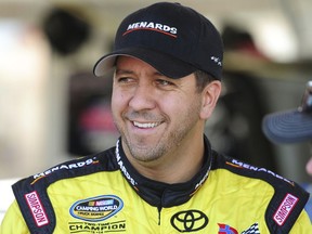 FILE - In this Oct. 1, 2016, file photo, NASCAR driver Matt Crafton  talks with his crew during the final practice session for the DC Solar 350 NASCAR Camping World Truck Series auto race at Las Vegas Motor Speedway in Las Vegas. The Truck Series will crown a champion Friday night, Nov. 17, 2017. The four contenders are two-time champion Matt Crafton, defending champion Johnny Sauter, Christopher Bell and Austin Cindric. (Josh Holmberg/Las Vegas Review-Journal via AP, File)