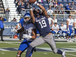 Nevada receiver Wyatt Demps (19) makes a catch over San Jose State' Andre Chachere in the first half of an NCAA college football game in Reno, Nev. Saturday, Nov. 11, 2017. (AP Photo/Tom R. Smedes)