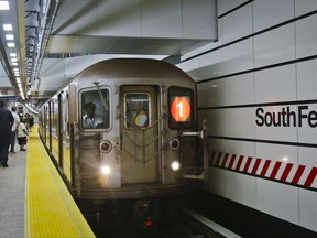 FILE - In this June 27, 2017 file photo, the No. 1 subway train pulls into the South Ferry Station in New York.  When it comes to the New York City subways, there's no such thing as ladies and gentlemen. Guidance issued by the Metropolitan Transportation Authority this Nov. 2017,  tells subway train conductors to use gender-neutral "riders" or "passengers" instead. The change is just one in the new communication rules, which also include conductors giving delayed passengers as much information as they can, and pointing out nearby tourist attractions.  (AP Photo/Bebeto Matthews)