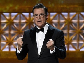 FILE - In this Sept. 17, 2017 file photo, Host Stephen Colbert speaks at the 69th Primetime Emmy Awards at the Microsoft Theater in Los Angeles.  Colbert, Tom Cruise, and the late Supreme Court Justice Antonin Scalia are among the 51 people nominated for the New Jersey Hall of Fame. The hall honors people in five categories who live or have lived in New Jersey. (Photo by Chris Pizzello/Invision/AP,File)