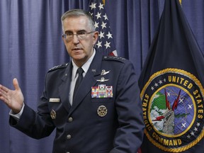 FILE - In this Thursday, Nov. 3, 2016 file photo, Air Force Gen. John Hyten, the incoming commander of the United States Strategic Command, speaks to reporters following a change of command ceremony at Offutt Air Force Base in Bellevue, Neb. On Saturday, Nov. 17, 2017, the top officer at U.S. Strategic Command says an order from President Donald Trump or any of his successors to launch nuclear weapons can be refused if that order is determined to be illegal. (AP Photo/Nati Harnik)