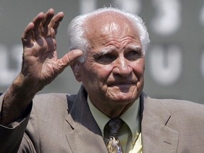 FILE - In this Aug. 2, 2007, file photo, Boston Red Sox Hall of Famer Bobby Doerr waves to the crowd at Fenway Park in Boston, prior to a baseball game between the Red Sox and the Baltimore Orioles. Doerr, a Hall of Fame second baseman who was dubbed the "silent captain" by longtime Red Sox teammate and life-long friend Ted Williams, has died. He was 99. (AP Photo/Elise Amendola, File)