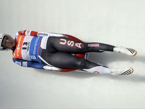 FILE - In this Dec. 17, 2016, file photo, Erin Hamlin, of the United States, speeds down the course during the women's World Cup Luge event in Park City, Utah. Hamlin came in first place. This is not a gold-medal-or-bust season for USA Luge star Erin Hamlin, who is bidding for a fourth Olympic appearance. She's getting married next summer and is likely headed toward retirement, but she's still one of the elite sliders in her sport. (AP Photo/Rick Bowmer, File)