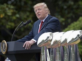 FILE - In this April 19, 2017, file photo, President Donald Trump speaks on the South Lawn of the White House in Washington during a ceremony where he honored the Super Bowl Champion New England Patriots for their Super Bowl LI victory. Trump is renewing his complaints about NFL players who kneel during the national anthem. Players have been kneeling to protest racism and police brutality, particularly toward people of color. Trump says the act is disrespectful and is hurting the game. (AP Photo/Susan Walsh, File)