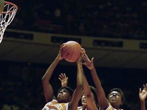 FILE - In this March 27, 1987, file photo, Bridgette Gordon (30) and Melissa McCray (35) of Tennessee double team Shannon Smith (21) of Cal State Long Beach as they go for a rebound during the first half of the NCAA Women's Final four semifinals in Austin, Texas. Bridgette Gordon starred on two of Tennessee's national championship teams and reached the Final Four each of her four seasons with the Lady Volunteers. Now the U.S. Olympic gold medalist is back at her alma mater as an assistant coach trying to help Tennessee regain the prominence it enjoyed during her own playing career. (AP Photo/David Breslauer, File)