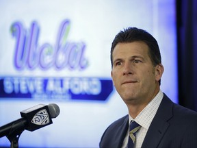 FILE - In this Oct. 12, 2017, file photo, UCLA head coach Steve Alford listens to questions during the Pac-12's NCAA college basketball media day, in San Francisco. Alford will sit the three players reportedly involved in a shoplifting incident in China for Saturday's game against Georgia Tech in Shanghai. Alford, however, declined to address the issue further. (AP Photo/Eric Risberg, File)