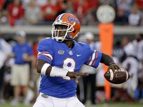 FILE - In this Oct. 28, 2017, file photo, Florida quarterback Malik Zaire looks for a receiver against Georgia in the second half of an NCAA college football game, in Jacksonville, Fla. Florida will start its third quarterback of the season Saturday at Missouri. Interim coach Randy Shannon announced Thursday, Nov. 2, 2017,  that graduate transfer Malik Zaire will start against the Tigers, a game the Gators probably need to win to make a bowl. (AP Photo/John Raoux, File)