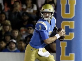 FILE - In this Nov. 11, 2017, file photo, UCLA quarterback Josh Rosen looks to pass against Arizona State during the first half of an NCAA college football game in Pasadena, Calif.  Sam Darnold and Josh Rosen have become friends while growing into top NFL quarterback prospects with crosstown rivals Southern California and UCLA. They'll meet on the field for the first time Saturday - and it will probably be the last time until they get together again on Sundays.(AP Photo/Chris Carlson, File)