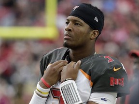 FILE - In this Sunday, Oct. 15, 2017, file photo, Tampa Bay Buccaneers quarterback Jameis Winston stands on the sidelines during the second half of an NFL football game against the Arizona Cardinals in Glendale, Ariz. Winston is being investigated for allegedly groping a female Uber driver in 2016. The Buccaneers quarterback has denied the charge on his Twitter and Instagram accounts.  (AP Photo/Rick Scuteri, File)