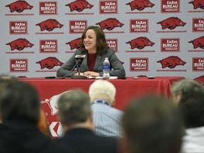 FILE - In this Nov. 24, 2017, file photo, Julie Cromer Peoples, interim athletic director for the University of Arkansas, talks about the decision to fire Arkansas coach Bret Bielema  at a press conference in Fayetteville, Ark. Arkansas will use a pair of firms to aid in the search for its new athletic director and football coach. The school announced the hiring of firms Korn Ferry and DHK International on Tuesday, Nov. 28, 2017, two weeks after Chancellor Joseph Steinmetz fired former athletic director Jeff Long _ and less than a week after interim athletic director Julie Cromer Peoples fired former coach Bret Bielema.  (AP Photo/Michael Woods, File)