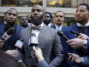 In this Tuesday, Oct. 17, 2017, file photo, Former NFL football player Anquan Boldin, left, Philadelphia Eagles Malcolm Jenkins, center, and San Francisco 49ers Eric Reid, right, speak to the media outside the league's headquarters after meetings in New York. San Francisco 49ers linebacker Eric Reid says he left The Players Coalition because founder Malcolm Jenkins excluded Colin Kaepernick from meetings, and asked players if they would stop protesting the anthem if the NFL made a charitable donation to causes they support. (AP Photo/Richard Drew, File)