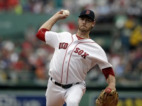 In this Sunday, Oct. 8, 2017  file photo, Boston Red Sox starting pitcher Doug Fister delivers during the first inning of Game 3 of baseball's American League Division Series against the Houston Astros in Boston. Free agent right-hander Doug Fister has signed a $4 million deal with the Texas Rangers, who are still in the market for more starting pitching. The Rangers announced the deal Tuesday, Nov. 28, 2017 after Fister had completed a physical.(AP Photo/Charles Krupa, File)