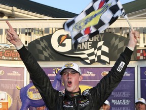 FILE - In this Aug. 5, 2016, file photo, Austin Cindric celebrates in Victory Lane after winning the NASCAR K&N Pro series auto race at Watkins Glen International in Watkins Glen, N.Y. The Truck Series will crown a champion Friday night, Nov. 17, 2017. The four contenders are two-time champion Matt Crafton, defending champion Johnny Sauter, Christopher Bell and Austin Cindric. (AP Photo/Mel Evans, File)