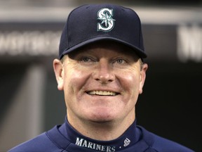 FILE - In this Sept. 25, 2013, file photo, then-Seattle Mariners manager Eric Wedge smiles before a baseball game against the Kansas City Royals, in Seattle. Former Cleveland and Seattle manager Eric Wedge has become the second person to interview with the New York Yankees for their dugout opening. He follows Yankees bench coach Rob Thomson, who interviewed Wednesday, Nov. 10, 2017. (AP Photo/Elaine Thompson, File)