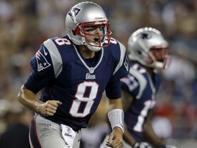 FILE - In this Aug. 9, 2012, file photo, New England Patriots quarterback Brian Hoyer (8) celebrates a touchdown during the second half of an NFL preseason football game against the New Orleans Saints in Foxborough, Mass. The Patriots announced Wednesday, Nov. 1, 2017, that they have signed Hoyer, who spent the first three of his nine NFL seasons with New England after originally joining the team as a rookie free agent out of Michigan State in 2009. (AP Photo/Elise Amendola, File)