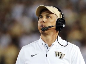 FILE - In this Saturday, Oct. 21, 2017, file photo, Wake Forest head coach Dave Clawson walks on the sideline during an NCAA college football game against Georgia Tech in Atlanta. Notre Dame first-year defensive coordinator Mike Elko will find himself this weekend across the field facing a group of players he once recruited to a program he helped build. Elko spent the last three seasons as the defensive coordinator at Wake Forest, which visits the fifth-ranked Fighting Irish on Saturday.  (AP Photo/David Goldman, File)