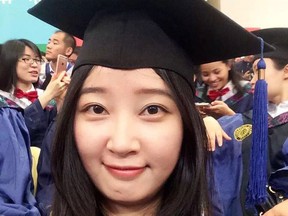 This 2016 selfie photo provided by her family shows Yingying Zhang in a cap and gown for her graduate degree in environmental engineering from Peking University Shenzhen Graduate School. She chose the University of Illinois at Urbana-Champaign for its highly regarded agriculture program. Zhang had been doing research on crop photosynthesis and was to begin her doctoral work in September 2017. (Family Photo via AP)