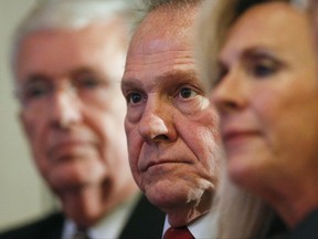 FILE - In this Thursday, Nov. 16, 2017 file photo, former Alabama Chief Justice and U.S. Senate candidate Roy Moore waits to speak at a news conference in Birmingham, Ala. (AP Photo/Brynn Anderson)