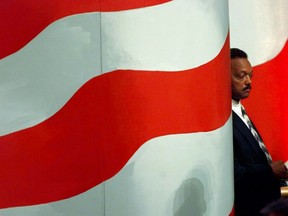 FILE - In this Tuesday, Aug. 27, 1996 file photo, Rev. Jesse Jackson waits while his son, Jesse Jackson Jr., introduces him to delegates at the United Center in Chicago during the Democratic National Convention. (AP Photo/Ron Edmonds)