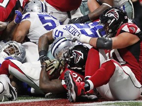 FILE - In this Nov. 12, 2017, file photo, Atlanta Falcons running back Tevin Coleman (26) scores a touchdown against the Dallas Cowboys during the first half of an NFL football game in Atlanta. Coleman kept the Falcons' running game moving for one week after Devonta Freeman left with a concussion. (AP Photo/David Goldman, File)