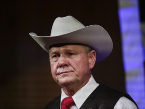 FILE - In this Monday, Sept. 25, 2017, file photo, former Alabama Chief Justice and U.S. Senate candidate Roy Moore speaks at a rally, in Fairhope, Ala. According to a Washington Post story Nov. 9, an Alabama woman said Moore made inappropriate advances and had sexual contact with her when she was 14. (AP Photo/Brynn Anderson, File)