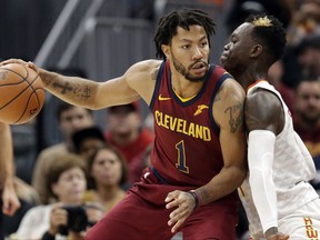 FILE - In this Nov. 5, 2017, file photo, Cleveland Cavaliers' Derrick Rose, left, drive against Atlanta Hawks' Dennis Schroder (17), from Germany, in the first half of an NBA basketball game in Cleveland. Rose has left the Cavaliers to attend to a personal matter, a team spokesman said Friday, Nov. 24, 2017. (AP Photo/Tony Dejak, File)
