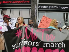 FILE - In this Nov. 12, 2017, file photo, participants rally outside CNN's Hollywood studios on Sunset Boulevard to take a stand against sexual assault and harassment for the #MeToo March in the Hollywood district of Los Angeles. A spate of recent public revelations, including the spontaneous #metoo discussions on social media, is emboldening many victims of sexual harassment to speak up, but many still remain silent. (AP Photo/Damian Dovarganes, File)