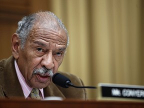 FILE- In this April 4, 2017, file photo, Rep. John Conyers, D-Mich., speaks during a hearing of the House Judiciary subcommittee on Capitol Hill in Washington. House Democratic Leader Nancy Pelosi is defending Conyers as an "icon" for women's rights and declining to say whether the longtime lawmaker should resign over allegations that he sexually harassed female staff members. (AP Photo/Alex Brandon, File)