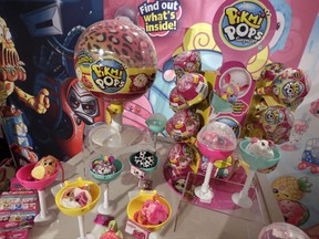 This Tuesday, Sept. 26, 2017, photo shows Pikmi Pops from Moose Toys on display at the 2017 TTPM Holiday Showcase in New York. Some of the hottest toys this year are LOL Surprise and Pikmi Pops. These and similar toys hide small stuffed animals or dolls inside plastic balls that are wrapped in several layers of packaging. Kids peel each layer, revealing tiny bags filled with trinkets, stickers, messages or other doll accessories as they go. (AP Photo/Richard Drew)