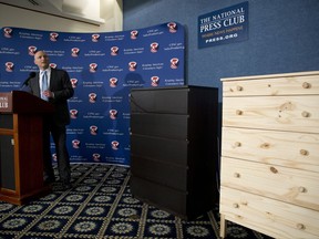 FILE - In this Tuesday, June 28, 2016, file photo, with two Ikea dressers displayed at right, Consumer Product Safety Commission (CPSC) Chairman Elliot Kaye speaks during a news conference at the National Press Club in Washington. Ikea is relaunching a recall of 29 million chests and dressers after the death of a seventh child attributed to one of the dressers tipping over. Ikea CEO Lars Petersson said the company wants to increase awareness of the recall campaign, first announced in June 2016, for several types of chest and dressers that can easily tip over if not properly anchored to a wall. (AP Photo/Carolyn Kaster, File)