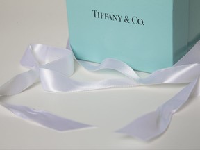 FILE - In this Monday, May 22, 2017, file photo, a gift box from Tiffany & Co. is arranged for a photo in Surfside, Fla. Tiffany & Co. reports earnings, Wednesday, Nov. 29, 2017. (AP Photo/Wilfredo Lee, File)