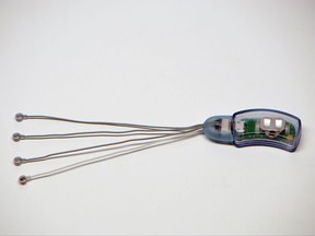 This photo provided by Innovative Health Solutions shows the NSS-2 Bridge. On Wednesday, Nov. 15, 2017, the Food and Drug Administration announced clearance of the NSS-2 Bridge, a brain-stimulating device for patients suffering from debilitating withdrawal symptoms caused by addiction to heroin and other opioids. The nerve stimulator is the first device to treat such symptoms including joint pain, anxiety, stomach aches and insomnia. (Courtesy of Innovative Health Solutions, Inc. via AP)